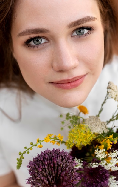 Close up woman posing with flowers