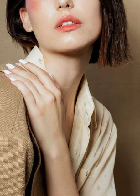 Close-up of woman posing with hand