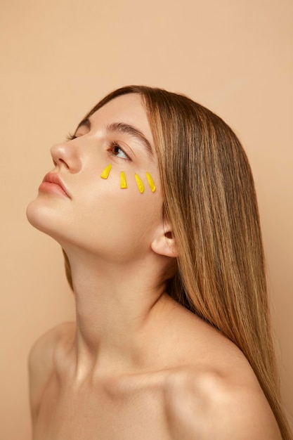 Free photo close up woman posing with petals