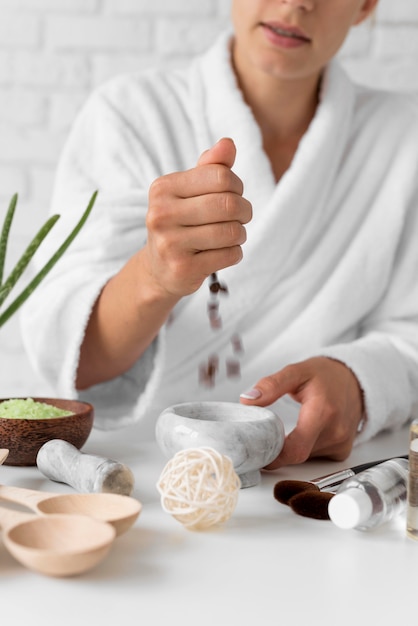 Free Photo close-up woman preparing remedy