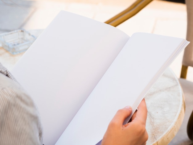 Close-up woman reading a mock-up magazine