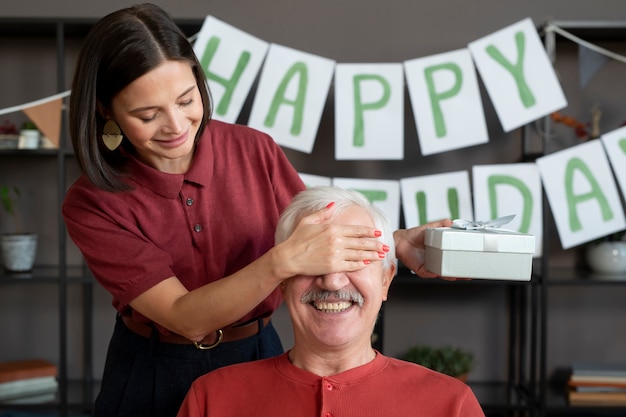 Close up woman surprising senior man