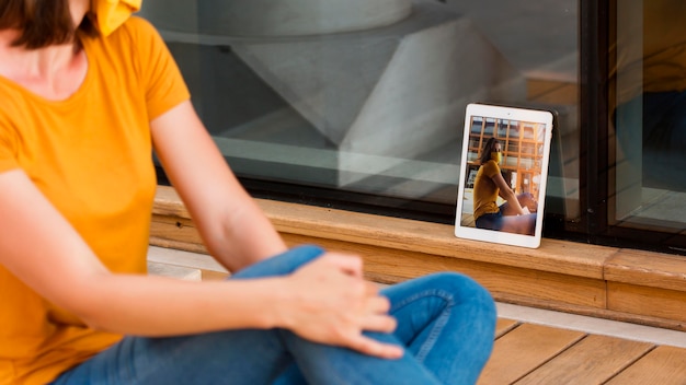 Close-up woman taking photo with tablet