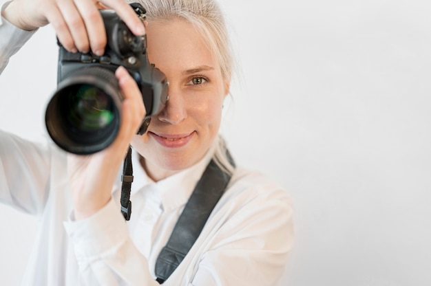 Free photo close-up woman taking a photo