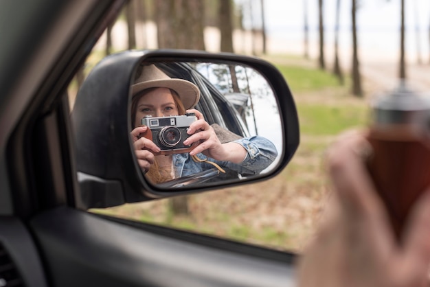 Free Photo close up woman taking photos with camera