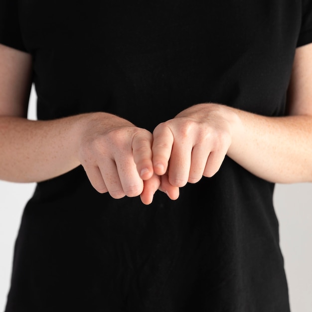 Close-up woman teaching sign language