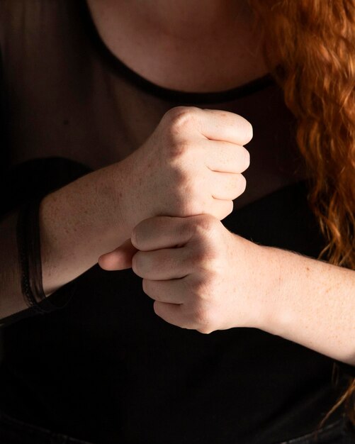 Close-up woman teaching sign language