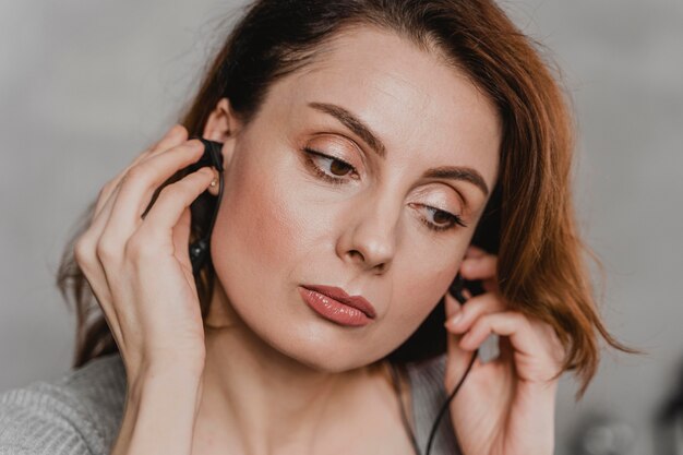 Close-up woman wearing earphones