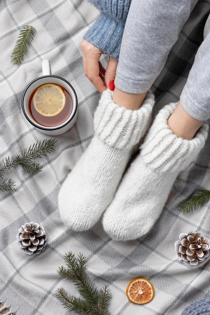 Free Photo close up woman wearing warm socks