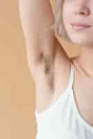 Free photo close up woman with armpit hair