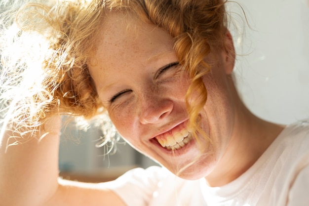 Close-up woman with big smile and ginger hair