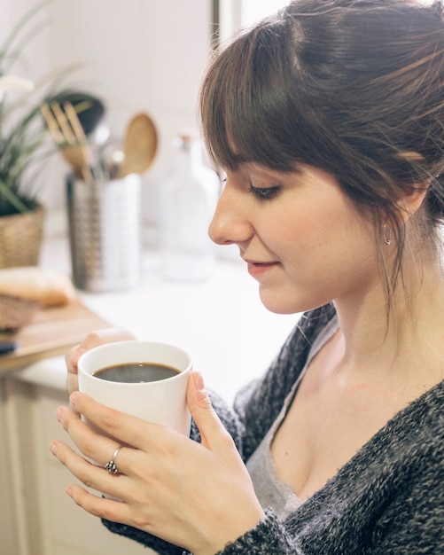 Close-up of a woman with black tea