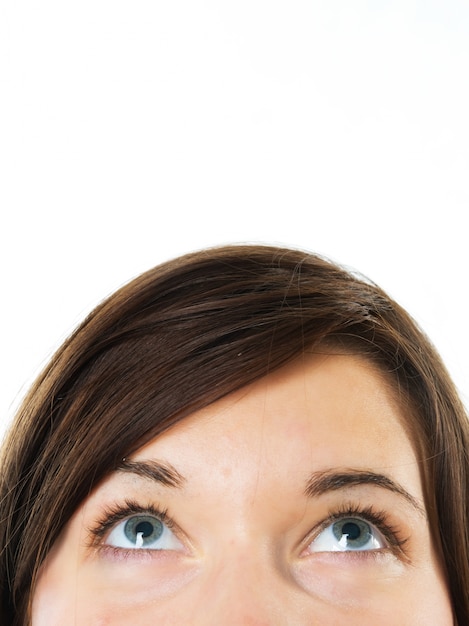 Free photo close-up of woman with blue eyes looking up