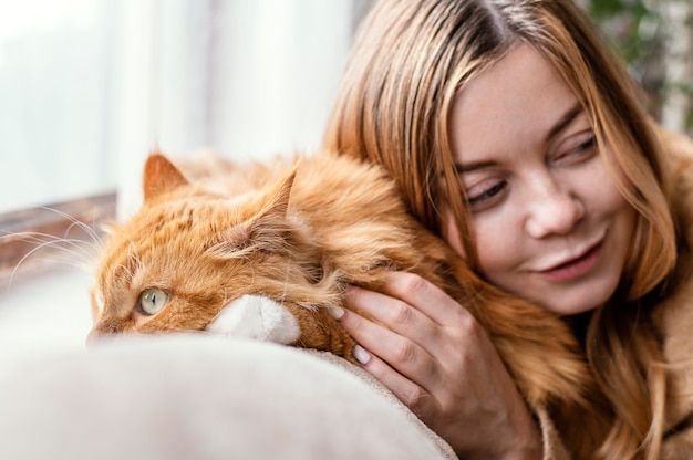 Free Photo close up woman with cute cat