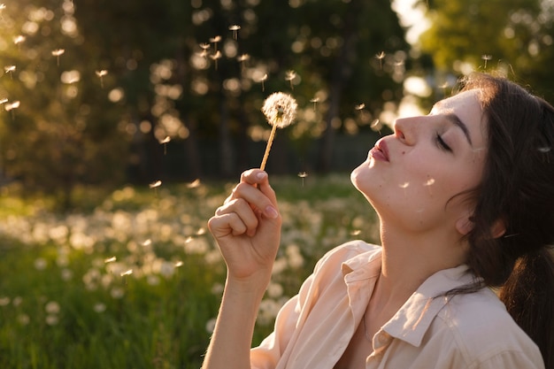 Close up woman with dandelion