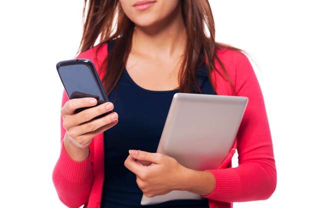 Close-up of woman with digital tablet and mobile phone