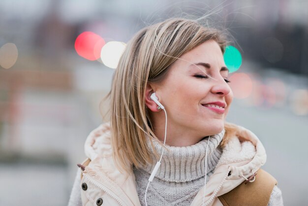 Close-up woman with earphones