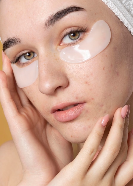 Close up woman with eye patches