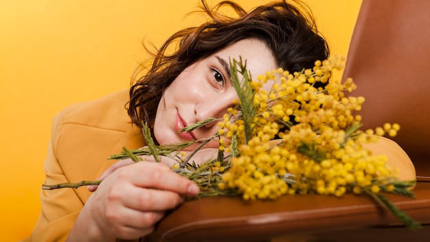 Close-up woman with flowers branches