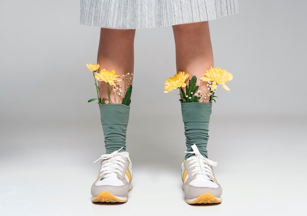 Free photo close up woman with flowers on socks