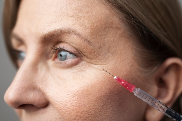 Close up woman with hyaluronic acid injection