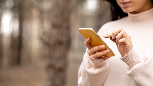 Close-up woman with mobile