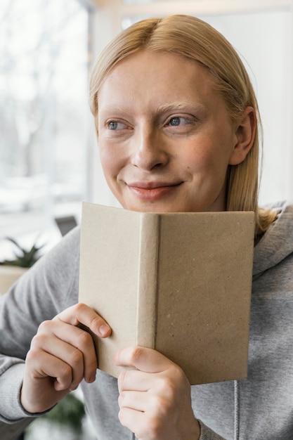 Close-up woman with notebook