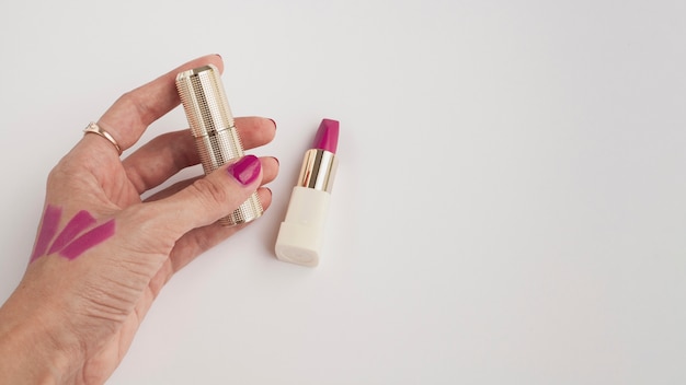 Close-up woman with pink lipstick and white background