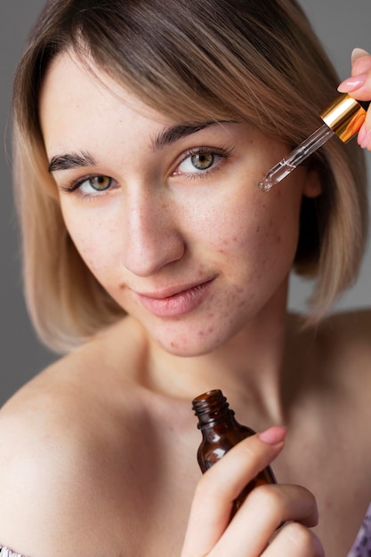 Free Photo close up woman with serum