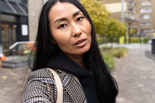 Close-up woman with urban background