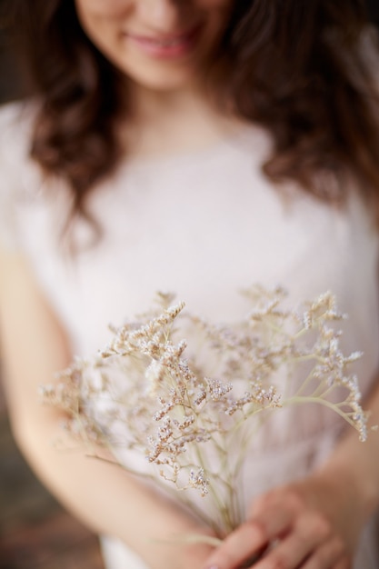 Free Photo close-up of woman with a wildflower