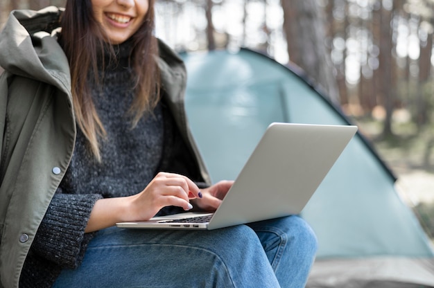 Close up woman working on laptop