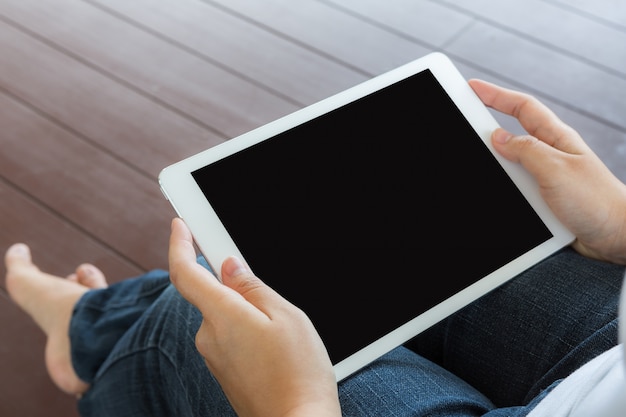 Close-up of woman working with her tablet