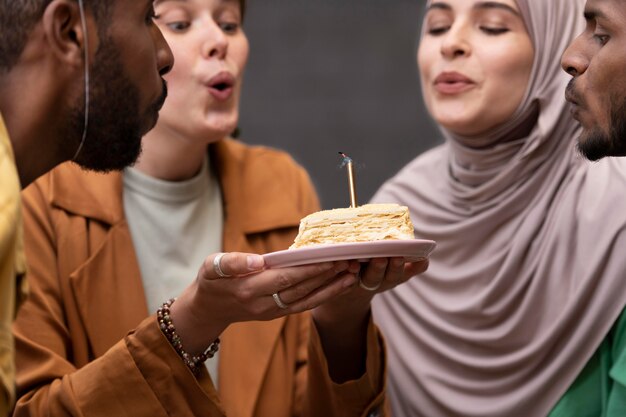 Close up women blowing candle