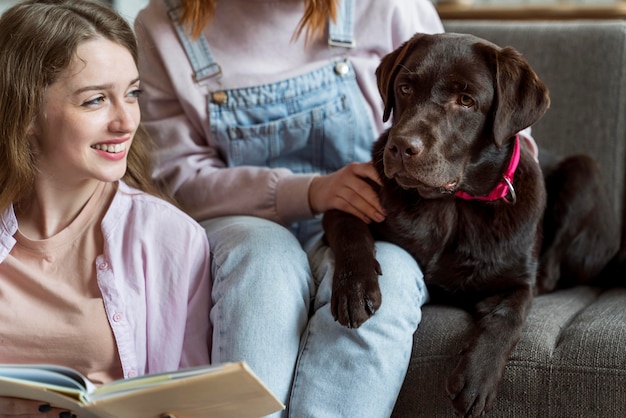 Free Photo close up women and dog indoors