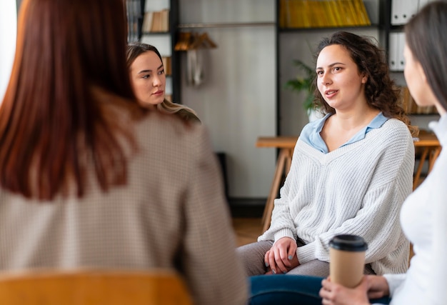 Free photo close up women indoors at therapy