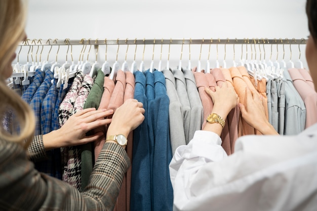 Close up women looking at clothes