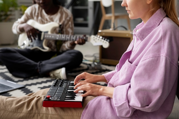 Free photo close up women playing at instruments