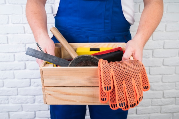 Free Photo close-up worker holding a toolbox