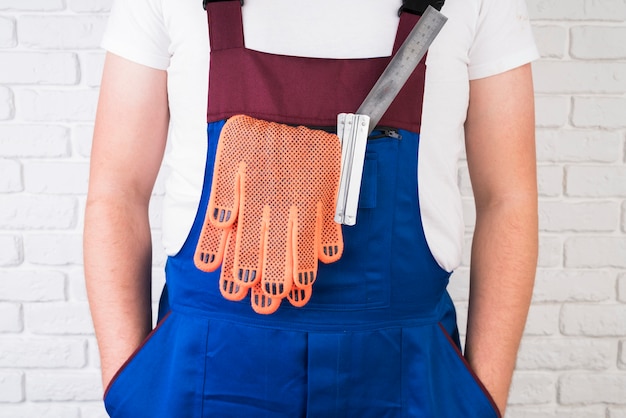 Free Photo close-up worker in overalls