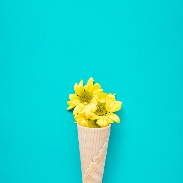 Close-up yellow flowers in waffle cone