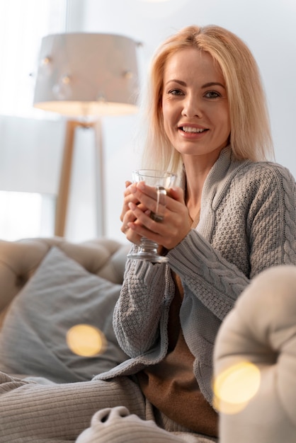 Close up on young adult enjoying warm drink