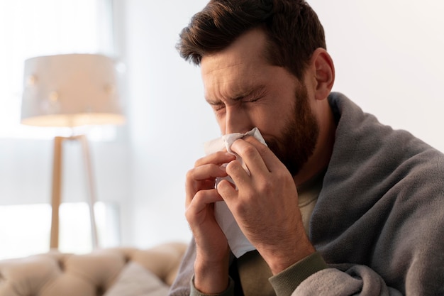 Close up on young adult sick at home