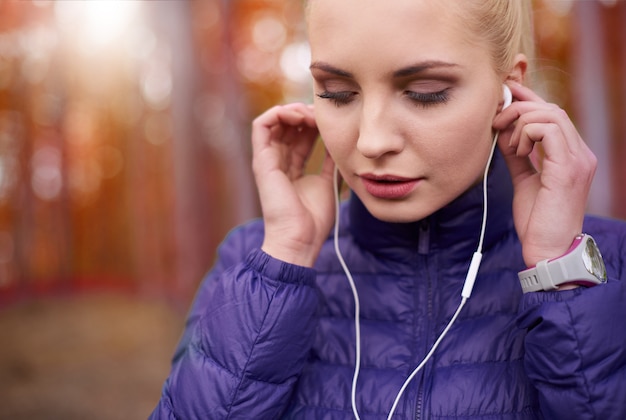 Close up on young beautiful woman jogging