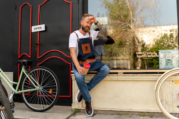 Close up on young businessman in bike shop