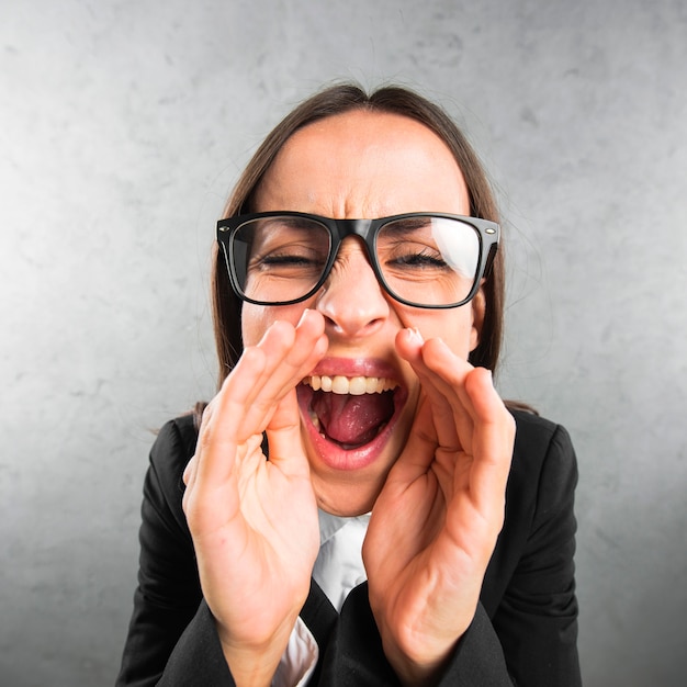 Free Photo close-up of a young businesswoman telling a secret