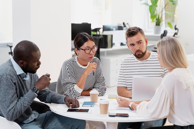 Free Photo close up on young colleagues having a meeting