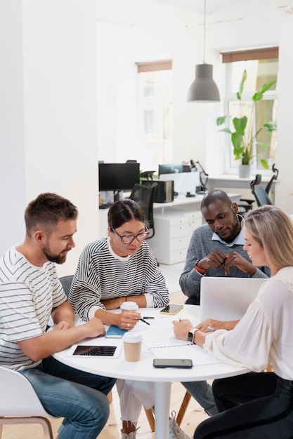 Free Photo close up on young colleagues having a meeting