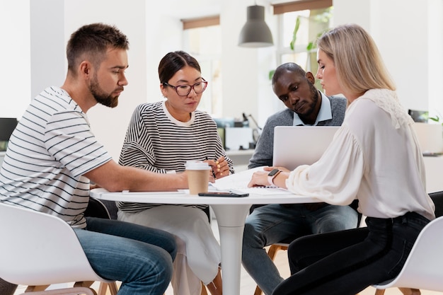 Free photo close up on young colleagues having a meeting