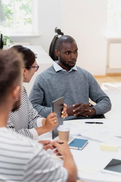 Close up on young colleagues having a meeting